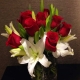 red roses and orchid arrangement